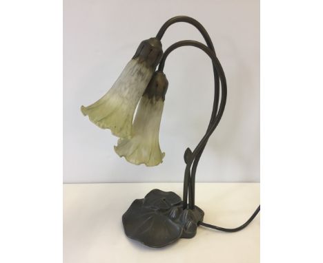 An Art Nouveau style table lamp with lily pad decoration.  40cm tall.