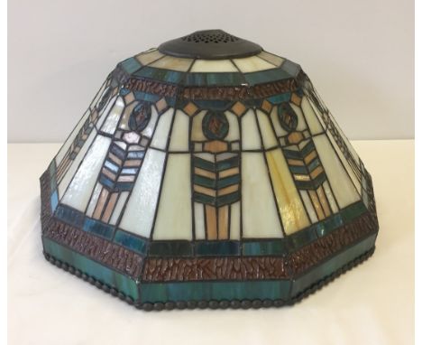 A Tiffany style glass lamp shade.  44cm diameter.