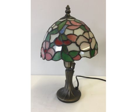 A Tiffany style table lamp 33cm tall, one small piece cracked.  