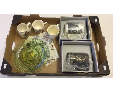 A box of commemorative items. To include ceramic mugs & silk scarves. 