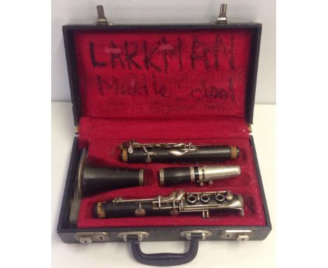 A cased Hsinghai clarinet. Case in need of attention. 