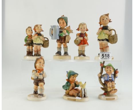 A collection of Goebel Hummel figures to include Boy in Apple Tree, Young Boy with Bird, Boy & Girl Hiking, Larger figures of