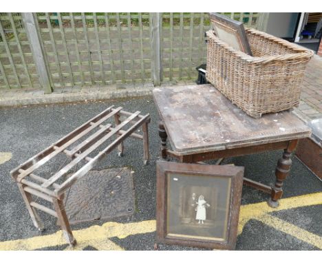 A oak dining table with a BT tub bench and a large wicker basket, together with 2 oak picture/mirror frames. (5)