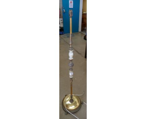 Cream and green onyx and brass standard lamp.