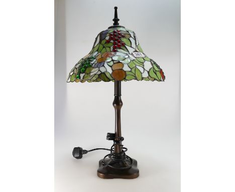 Large Tiffany style leaded glass table lamp on bronzed base.