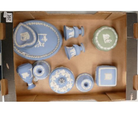 A mixed collection of Wedgwood items to include part dressing table sets, trinket boxes, candlesticks etc 