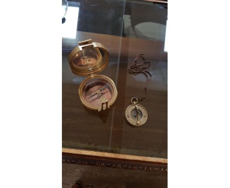 A Natural Sine compass and a sundial and compass.