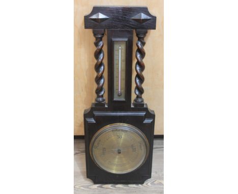 An oak aneroid barometer, the dial signed 'W. Greenwood &amp; Sons', length 69cm. 