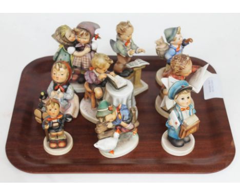 A group of nine Hummel figures.Condition: four figures with repairs and/or chips as pictured.