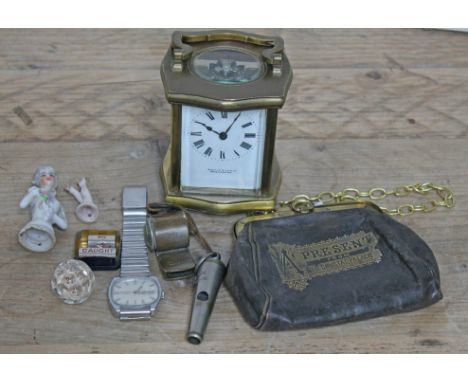 A mixed lot comprising a carriage clock, a pin cushion doll, a vintage stainless steel Accurist wristwatch, two old police wh