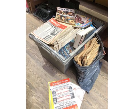 A crate of vintage boxing magazines and programmes including Boxing News, Boxing Illustrated, The Ring. Programmes include We