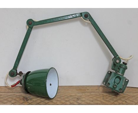A green enamel industrial wall mounting anglepoise lamp. 