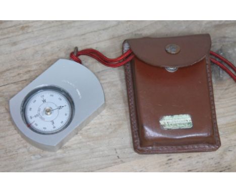 A Finish aluminium orienteering compass by Suunto Co Helsinki with leather case. 