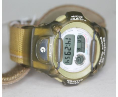 A Baby G digital wrist watch. 