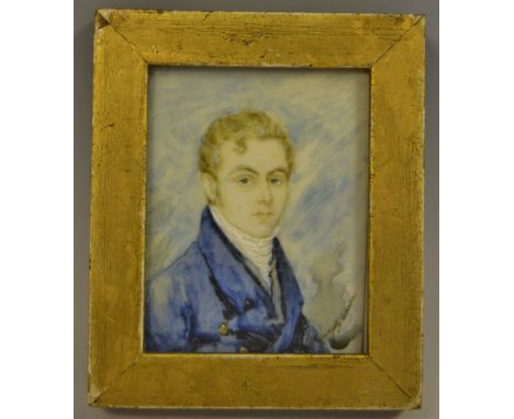 English School, a portrait miniature, of a young gentleman in a blue coat,  indistinctly signed, watercolour on ivorine, gilt