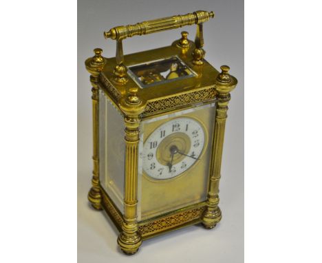 An early 20th century brass carriage clock, white enamel chapter ring, Arabic numerals