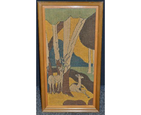 An Art Deco tapestry panel, depicting deer in a stylised geometric landscape, framed, c.1940