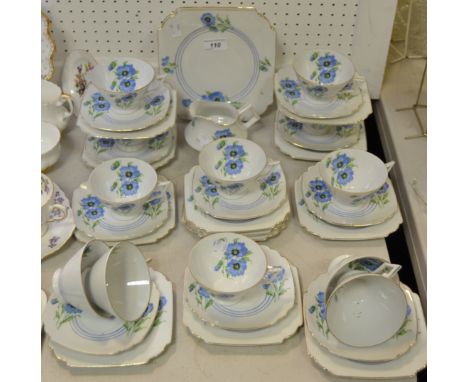 A continental Art Deco style part tea service, printed with blue Cornflowers