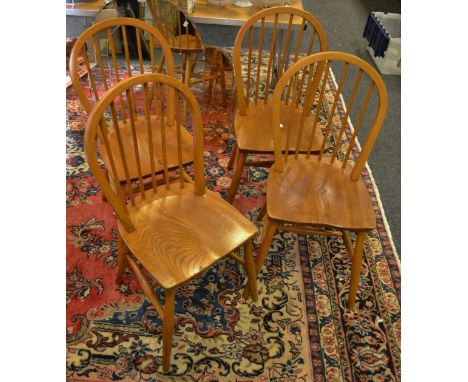 A set of four Ercol style stick back kitchen chairs