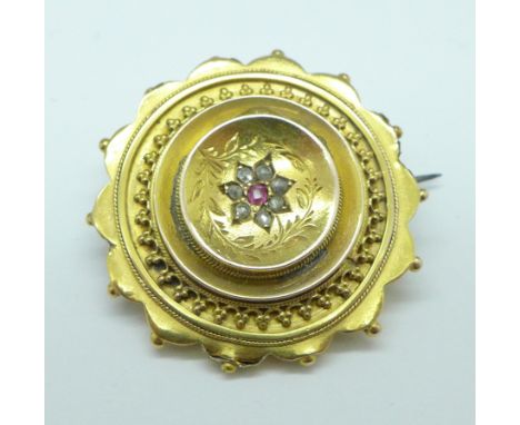 A yellow metal brooch set with old cut diamonds and a ruby, 7.9g, a/f, to the rim 