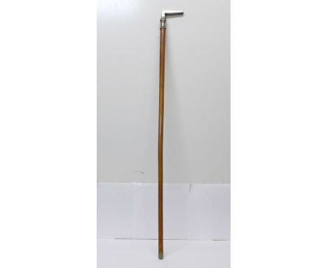 A walking stick with nickel top 