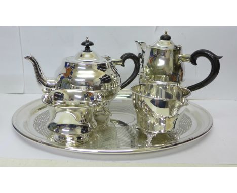 A three piece plated Thomas Wilkinson &amp; Sons tea service comprising teapot, cream and sugar, a basket and a tray 