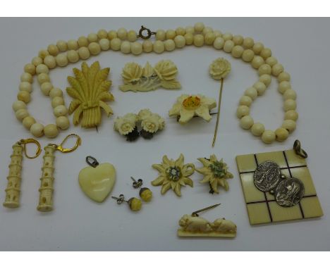 A collection of bone and ivory brooches, earrings, pendants, necklace and stick pin 