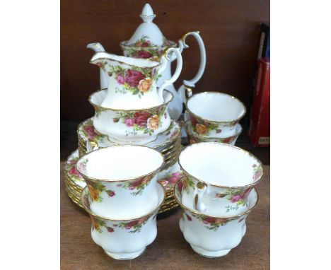 A Royal Albert Old Country Roses coffee set with six cups and saucers, cream, sugar, side plates and one other plate 