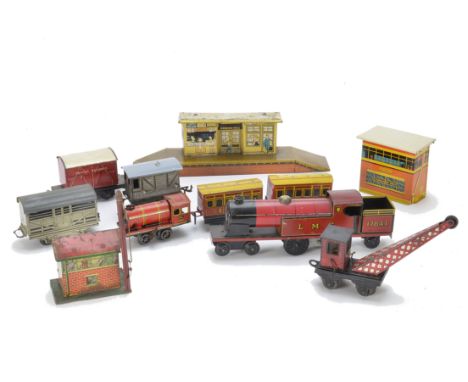 A Collection of 0 Gauge Trains and Accessories by Brimtoy Mettoy and Others, including small Brimtoy c/w locomotive, 2 coache