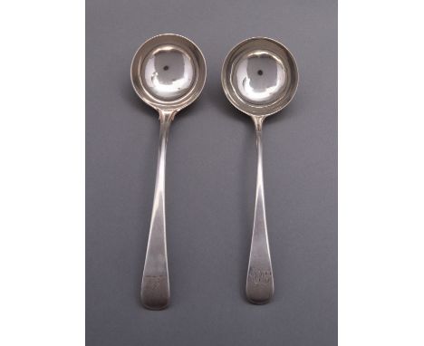 A George III silver Old English sauce ladle by Elizabeth Tookey, London 1769, engraved with a crest with a similar ladle by R