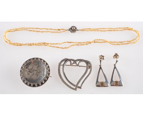 A small group of jewellery, including a Victorian brooch with swallow and foliate etching, marked to verso 'Real Silver', sun