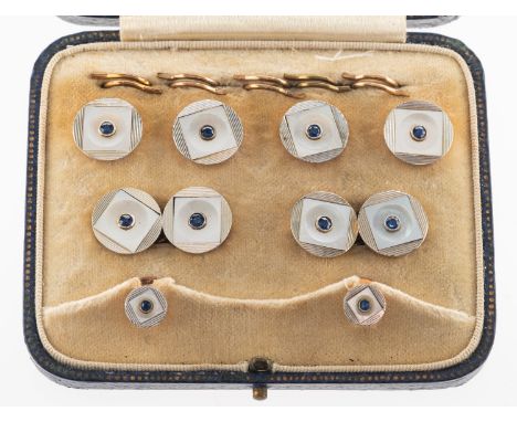 A set of Art Deco mother of pearl and sapphire buttons, cufflinks and shirt studs, of circular form, each with line engraving