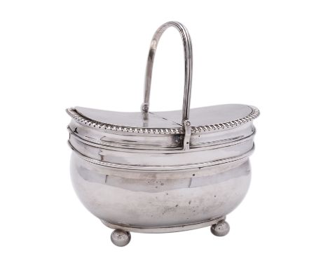 A George III silver tea caddy by Rebecca &amp; William Emes, London 1808, of barge shape, reeded swing handle, twin locking h