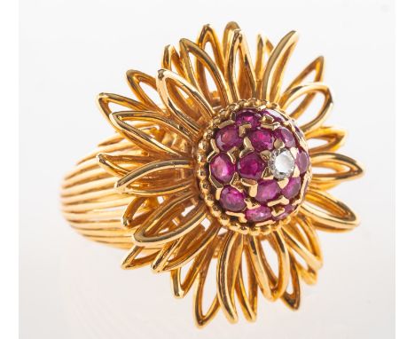 Sanitt &amp; Stein. An 18ct gold ruby and diamond cocktail ring, of openwork flowerhead form and bombé set with a brilliant-c