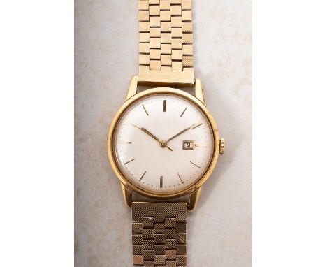International Watch Company (I.W.C.) a 9ct gold wrist watch the round cream dial with raised gilt baton hour markings, baton 