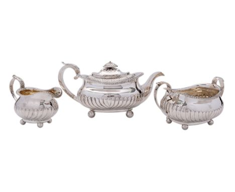 A George IV three piece silver tea service by James Wintle, London 1819/20, of barge shape, the sugar basin dated 1819, part 