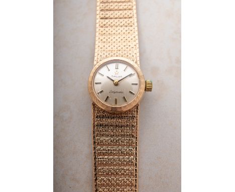 Omega Ladymatic a 9ct gold lady's wristwatch the round dial having raised baton numerals, baton hands and signed Omega, Ladym