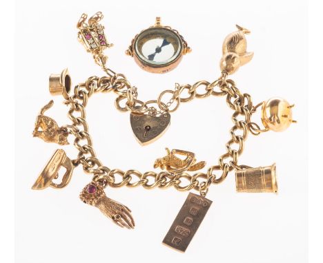 A charm bracelet with charms and a loose compass charm, a charm bracelet with heart padlock and safety chain, padlock partial