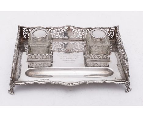 An Edward VII silver inkstand by William Hutton & Sons Ltd, London 1901, the wavy rim above a pierced gallery set on a stand 