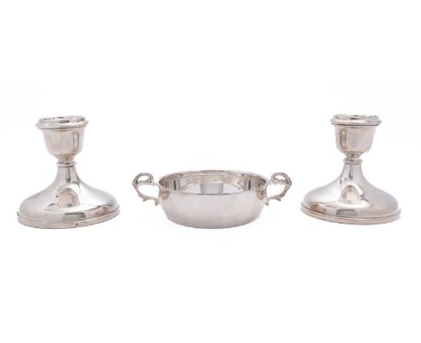 A pair of Elizabeth II dwarf silver candlesticks by Charles S Green &amp; Co Ltd, Birmingham 1959, with loaded bases, 9cm. (3