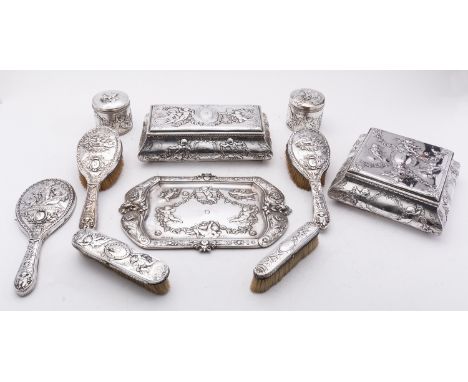 A Victorian matched ten piece silver dressing table set mostly by Elkington & Co Ltd Birmingham, comprising of a large square