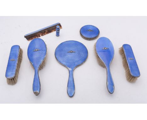 A mixed group of silver and enamel dressing table items with RAF emblems including; a hand mirror, two long handle hair brush