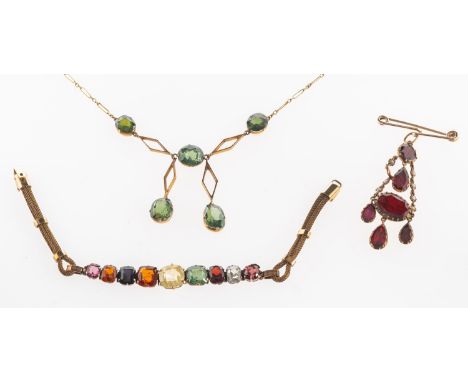 A group of gem-set and paste set jewellery, including a rolled gold Art Deco bracelet set with nine graduated cushion-cut gem