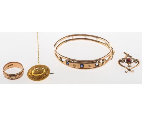 A mixed group of jewellery, including a Victorian openwork hinged bangle, the front panel star set with two circular-cut blue