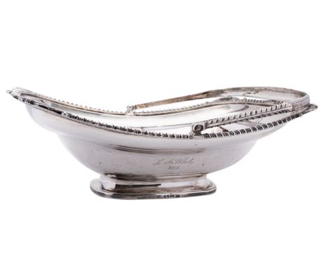 A George III silver swing handle basket by Thomas Robins, London 1809, of rectangular boat shape, the gadrooned border inters