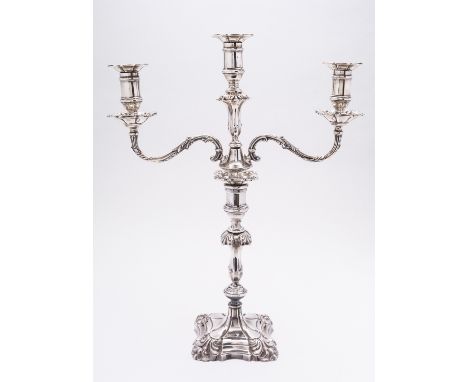A matched Edward VII silver candelabra by Hawksworth, Eyre & Co Ltd,  Sheffield 1917- base, 1913- arms, maker's mark on the a