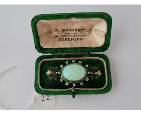 Antique Victorian green enamel 15ct brooch set with rose diamonds and a large central opal. Brooch size 50mm x 24mm, boxed