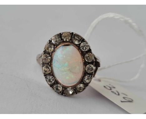 A silver opal and paste cluster ring, size M