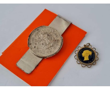 A Mexican coin money clip and a enamel half farthing 1843 pendant