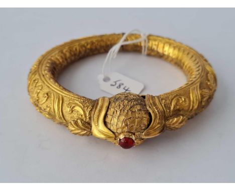 A large antique gilt bangle